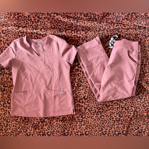 Mauve FIGS scrubs set. Casma top + Kade bottoms. Both sized medium.